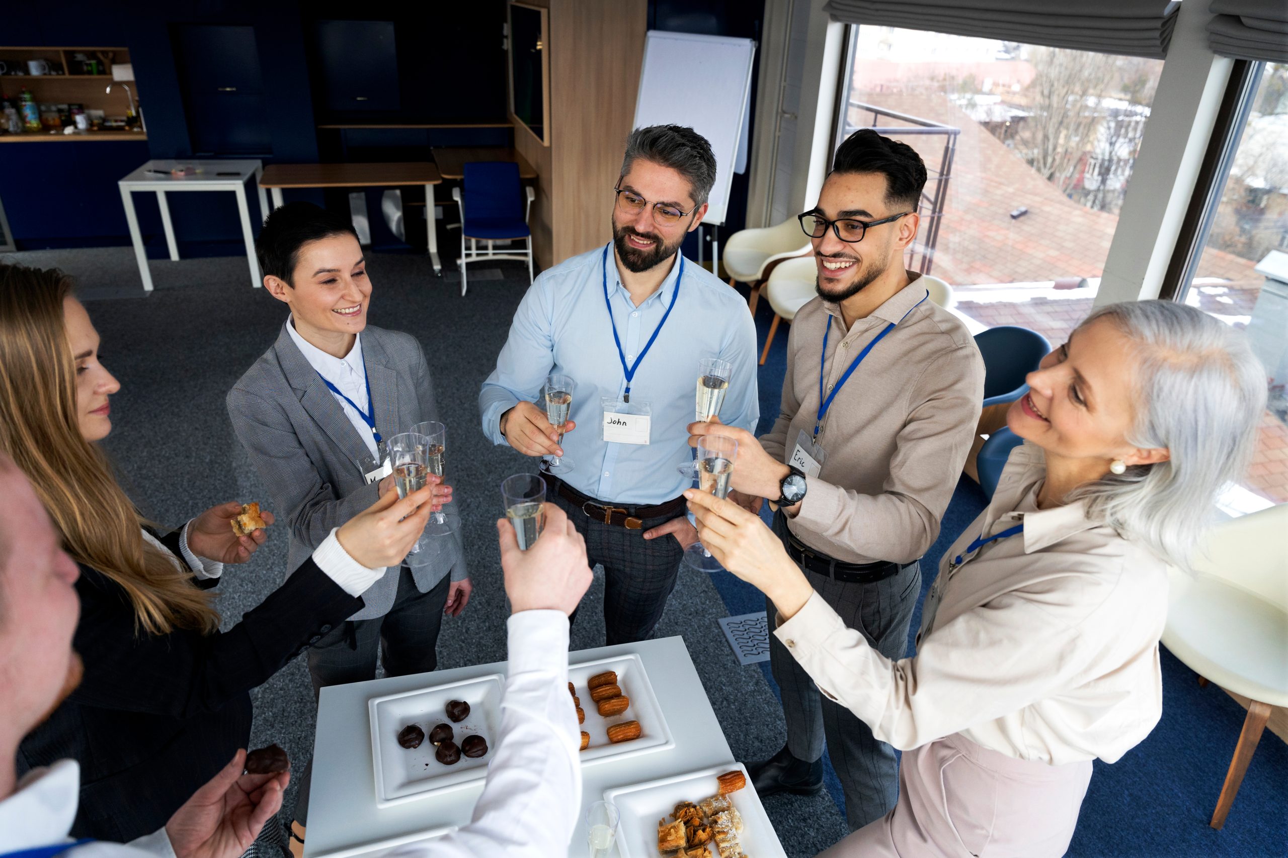 Corporate sponsors and executives toasting at a foundation partnership event